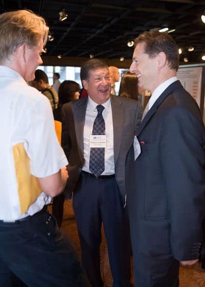 Dr. Schreiber, conversing with colleagues Mark J. Smyth, Ph.D., and Jonathan Cebon, Ph.D., at a CRI Symposium in 2007.