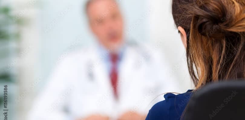 patient speaks to a physician